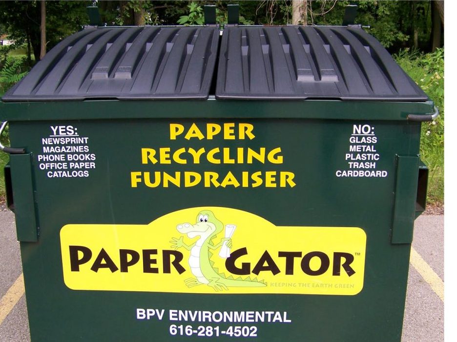 A green PaperGator paper recycling bin