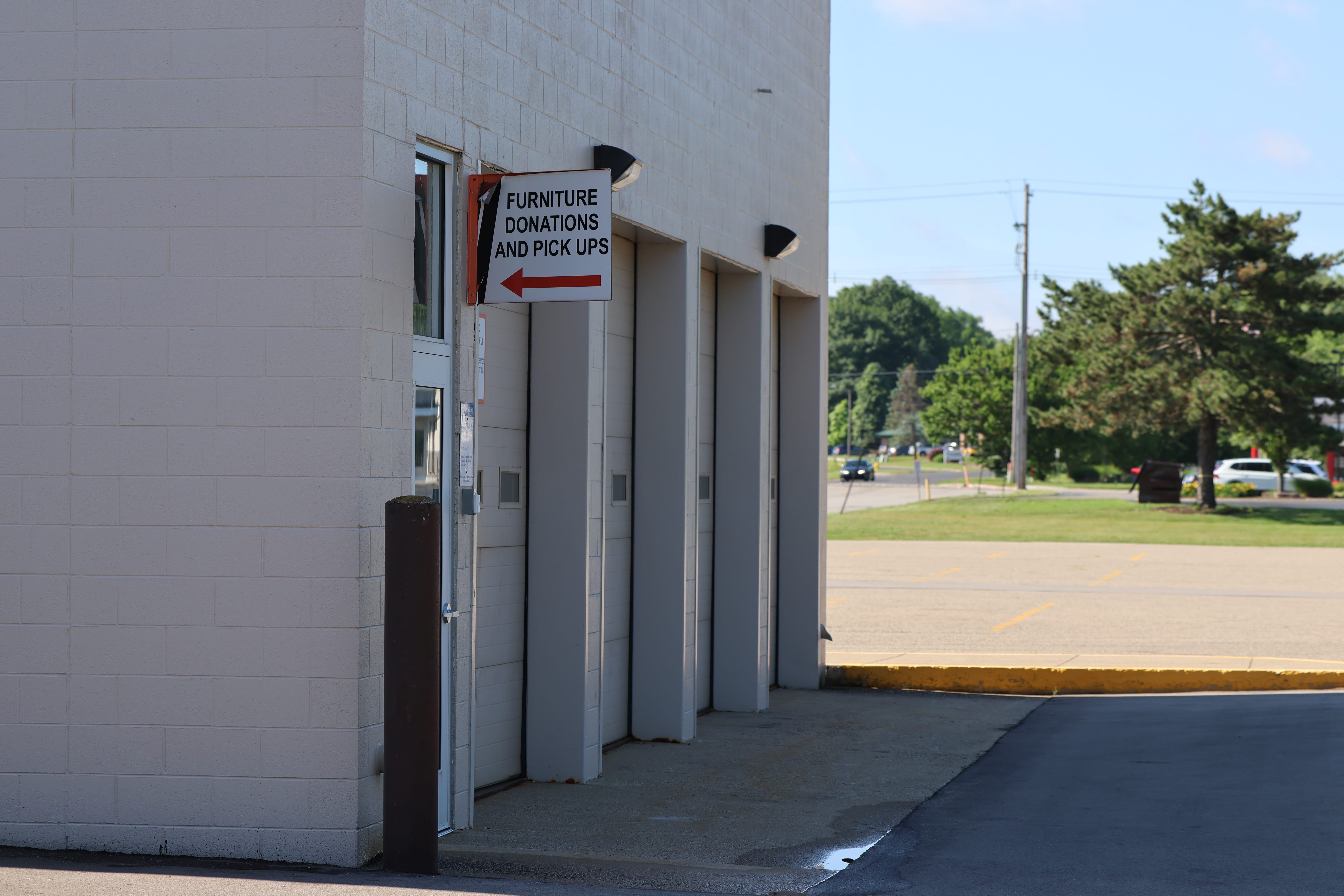 Furniture Donations and Pick Ups sign above the West garage doors at ditto